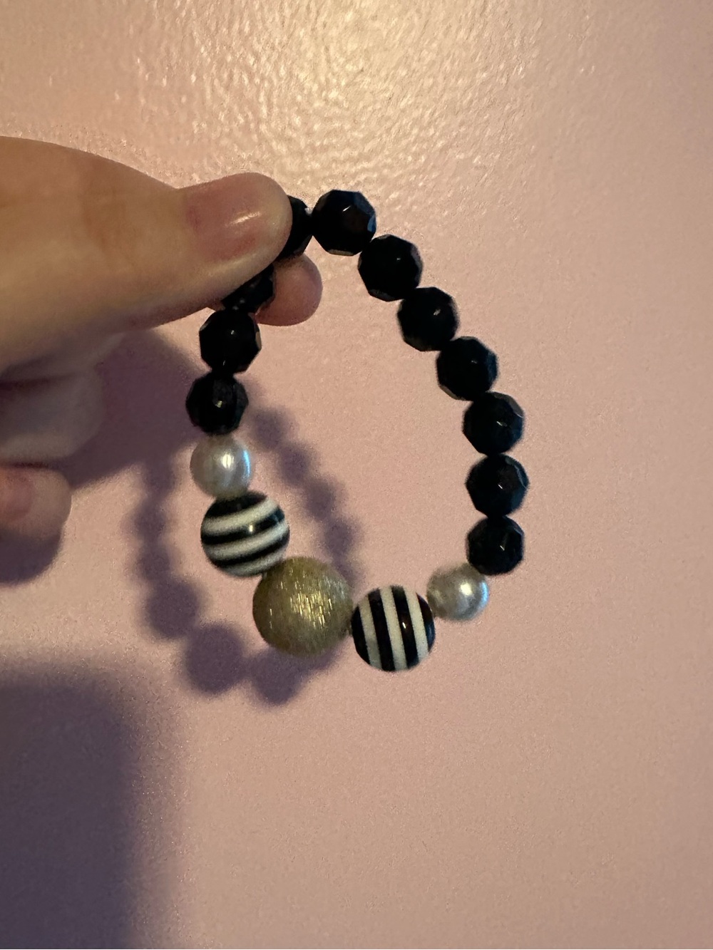 Girls black, gold, and white beaded bracelet